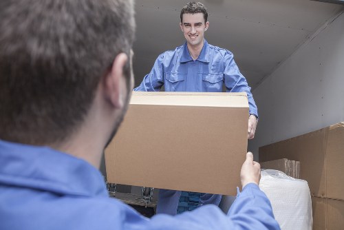Professional movers loading furniture into a truck in Great Bookham