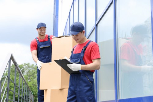 Professional movers handling household items in Luton