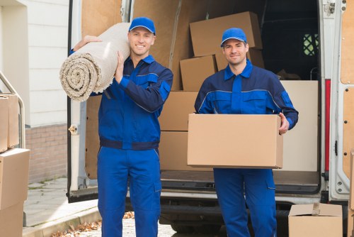 Professional movers handling furniture in North London