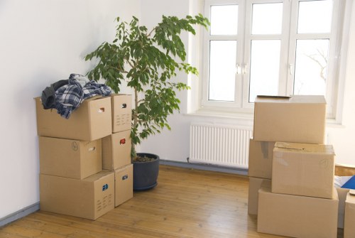 Professional movers assisting with a household move in South West London
