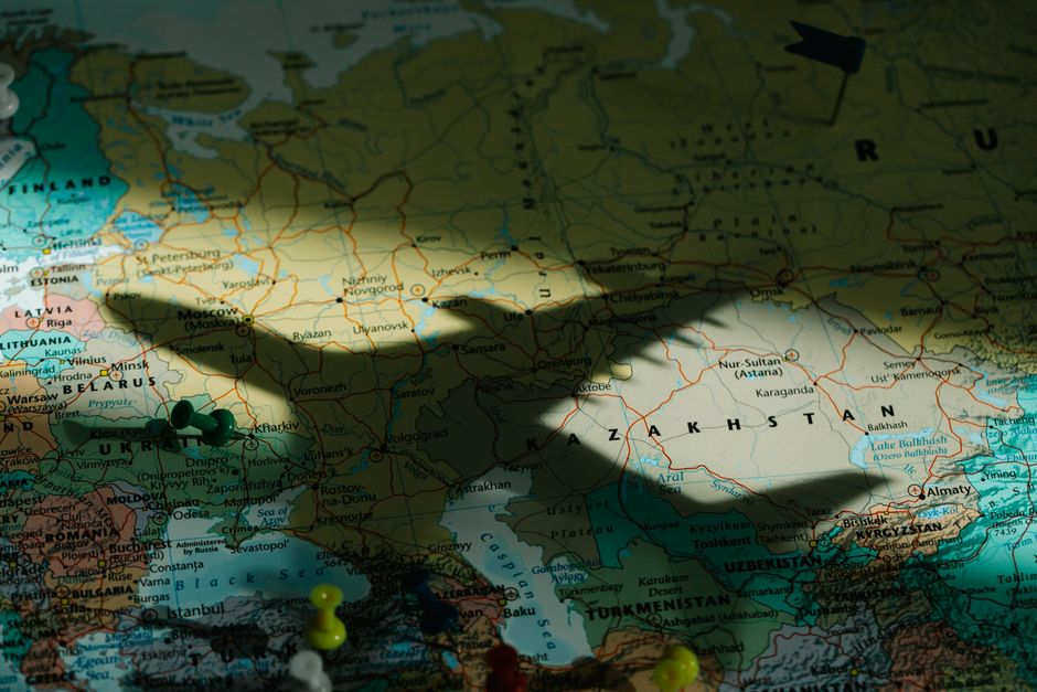 A detailed close-up of a world map highlighting central Asia, including countries such as Kazakhstan, Uzbekistan, Turkmenistan, and parts of Russia, Ukraine, and the Middle East. The map features vari
